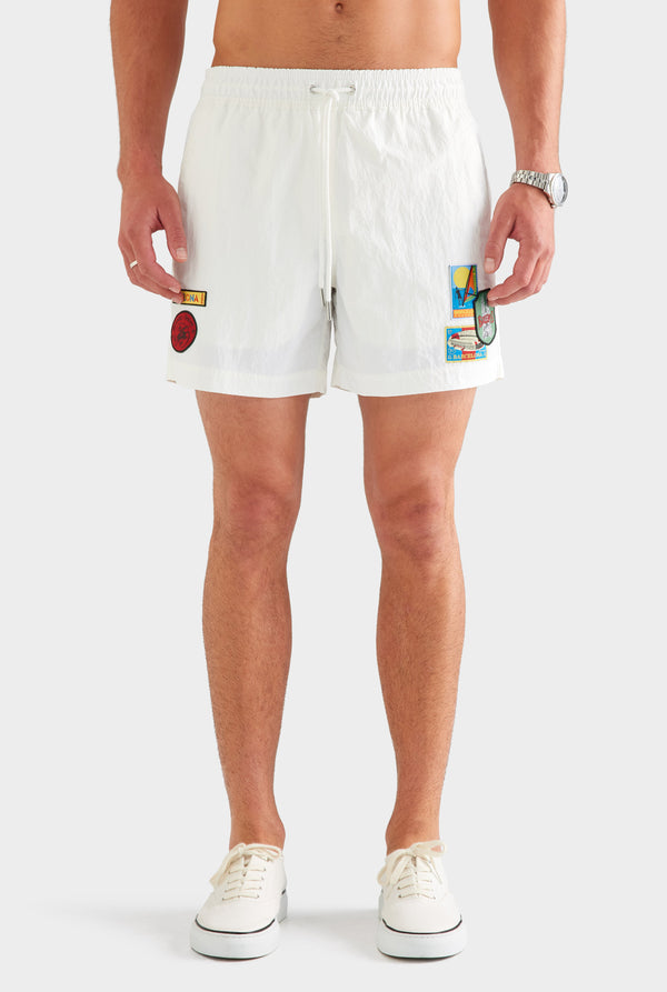 Nylon Swim Short - White/Travel Stickers [[AU_MEDIA:gid://shopify/MediaImage/27955548717143]]
