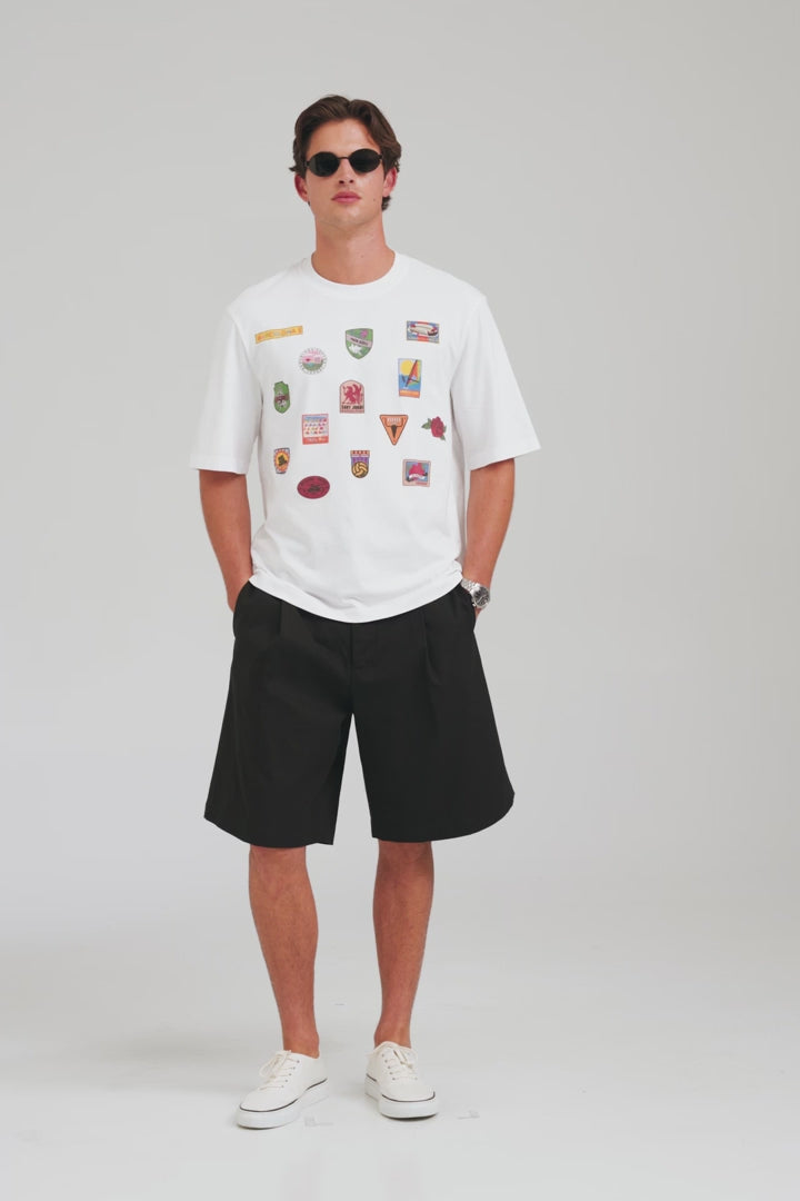 Oversized T-Shirt - White/Travel Stickers [[AU_MEDIA:gid://shopify/Video/27965302997079]]