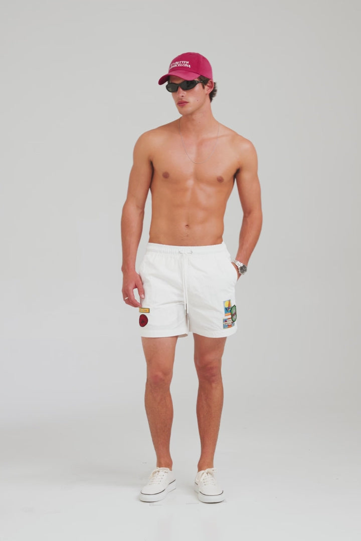 Nylon Swim Short - White/Travel Stickers [[AU_MEDIA:gid://shopify/Video/27965065560151]]